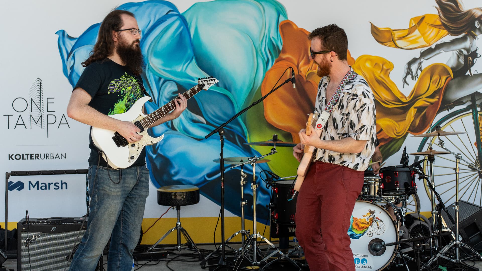 Two guitarists from Giorgi trading riffs at Gasparilla Festival of the Arts